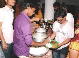 Rice being served at a community meal